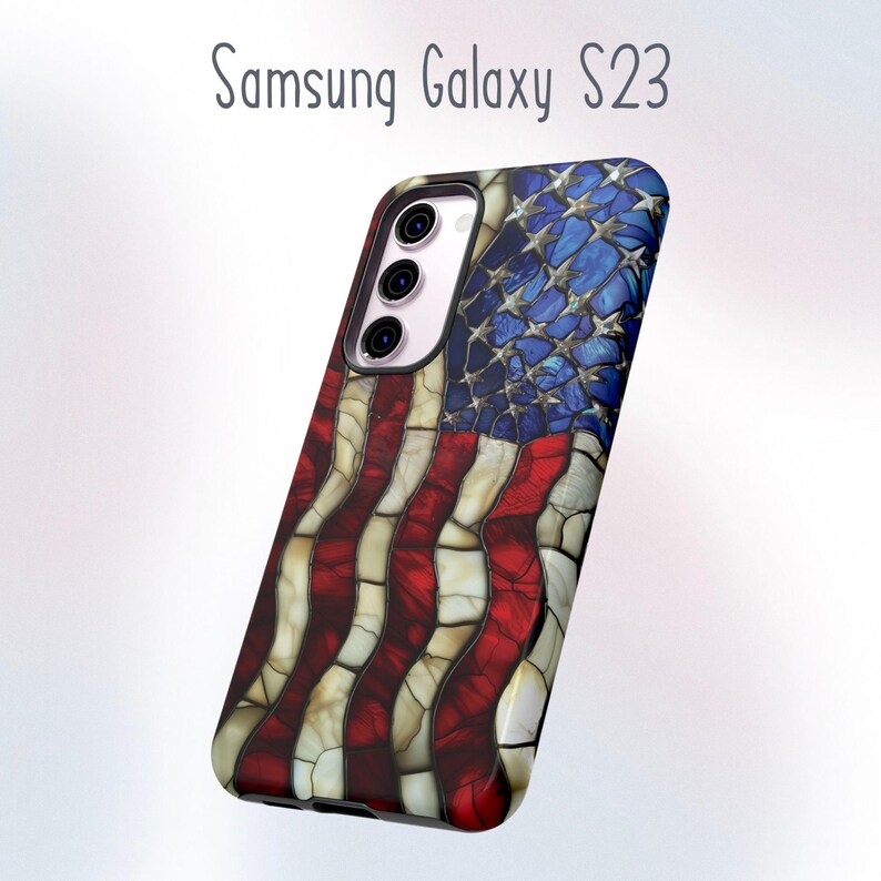 May include: A Samsung Galaxy S23 phone case featuring a mosaic American flag design. The case has a red, white, and blue color scheme, with a textured appearance. The top portion displays a blue field with white stars, while the bottom has red and white stripes.