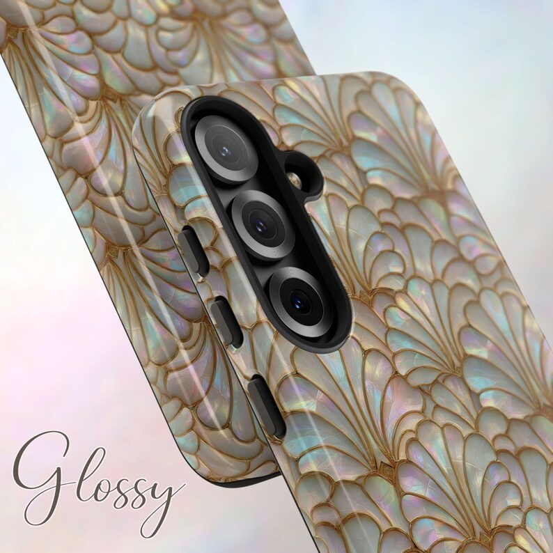 May include: Glossy phone case with a pearlescent, fan-shaped design in shades of white, gold, and iridescent hues. The case features a triple-lens camera and side buttons. The word "Glossy" is written in cursive.