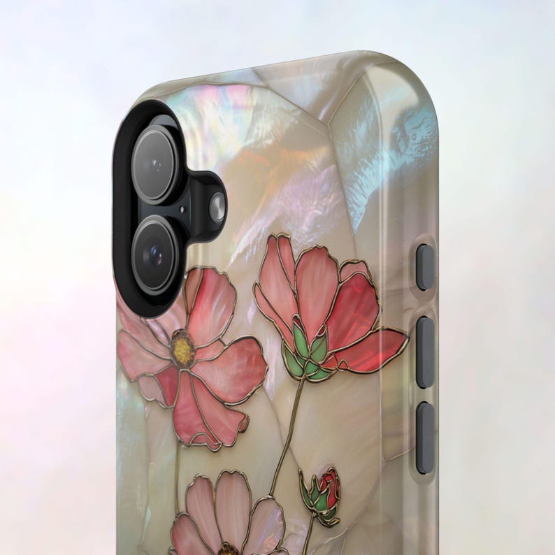 May include: A pearlescent phone case featuring a floral design with pink and red cosmos flowers. The flowers have gold outlines and green stems. The case has a camera cutout and side buttons.