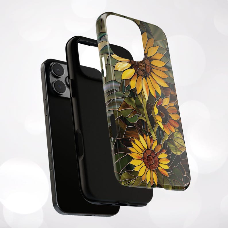 May include: A black phone case with a stained glass design featuring sunflowers in shades of yellow, orange, and brown.
