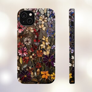 May include: A phone case with a stained glass design featuring a variety of colourful flowers. The case is black and has a cutout for the camera lens.