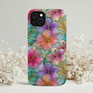 May include: A phone case featuring a stained glass style pattern of vibrant hibiscus flowers in shades of pink, purple, and orange, interspersed with teal and green leaves. The design includes thin gold outlines separating each petal and leaf segment.