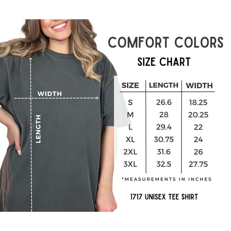 May include: A dark gray Comfort Colors unisex tee shirt with a size chart. The chart shows measurements in inches for sizes S to 3XL, with lengths from 26.6 to 32.5 inches and widths from 18.25 to 27.75 inches.
