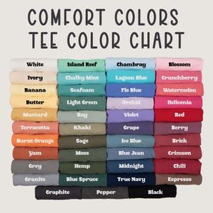 May include: A color chart for Comfort Colors t-shirts. The chart displays a variety of folded t-shirts in various colors, including white, blue, pink, green, and orange. The text "COMFORT COLORS TEE COLOR CHART" is at the top.