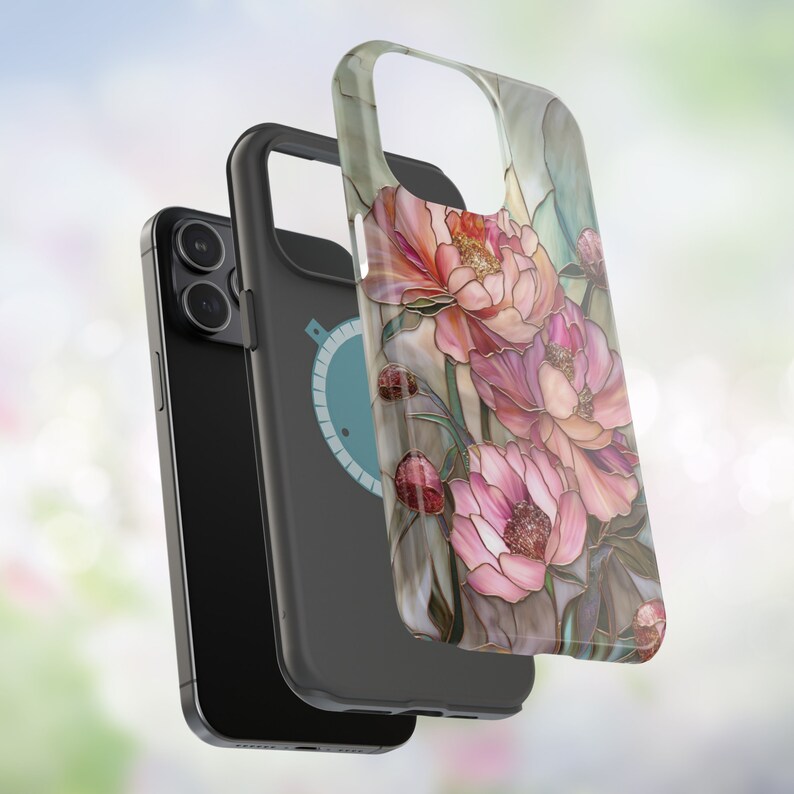 May include: A clear phone case with a floral design featuring pink and white peonies on a gray background. The case is designed for a smartphone with a camera bump.