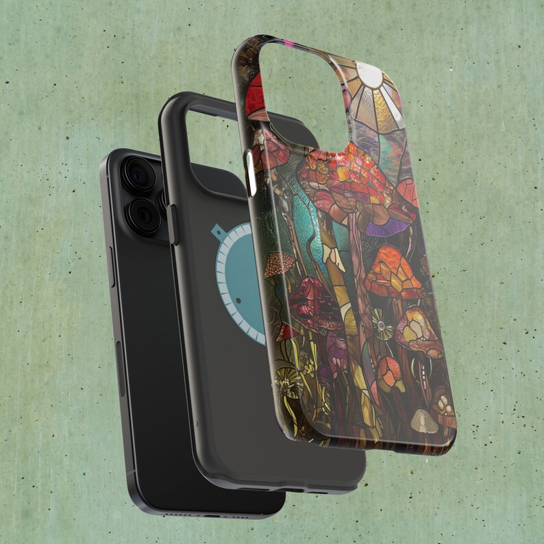 May include: A black phone case with a colorful stained glass design featuring mushrooms and a sun. The design is reminiscent of a psychedelic art style.