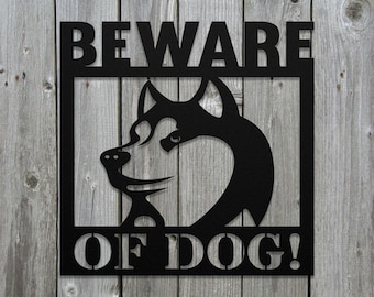 May include: Black metal sign with the words "BEWARE OF DOG!" and a silhouette of a husky dog's head.