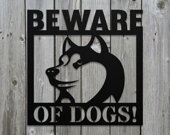 May include: Black metal sign with the text "BEWARE OF DOGS!" and a silhouette of a husky dog's head.