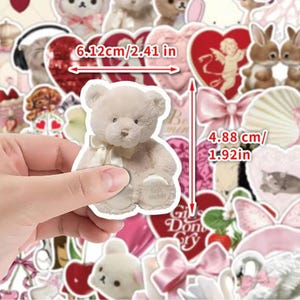 May include: A sheet of stickers featuring a variety of cute designs, including a teddy bear, hearts, bows, and a bunny. The stickers are approximately 2.41 inches wide and 1.92 inches tall.