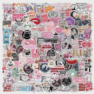May include: A collection of stickers with various designs and text, including hearts, books, and phrases like "Spicy Book Club" and "Enemies to Lovers." The stickers are in shades of pink, white, and black.
