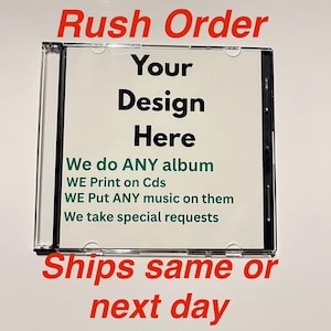 May include: A clear CD case with a white insert. The insert has the words "Your Design Here" in black, with additional text in green and red. The text includes "We do ANY album" and "Ships same or next day."