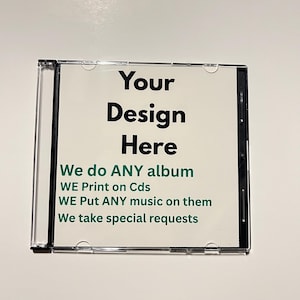 May include: A clear CD case with a white insert. The insert has the text "Your Design Here" in black, and additional green text that reads "We do ANY album, WE Print on Cds, WE Put ANY music on them, We take special requests."