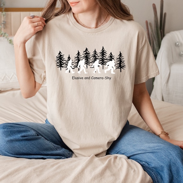 Elusive and camera-shy Unisex Softstyle T-Shirt, Bigfoot shirt, bigfoot tshirt, outdoor shirt, camping shirt, hiking tshirt.