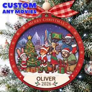 May include: A round wooden Christmas ornament featuring a Zootopia-themed illustration with characters decorating a tree. The red frame reads MERRY CHRISTMAS, and the bottom banner displays the name OLIVER and the year 2026.