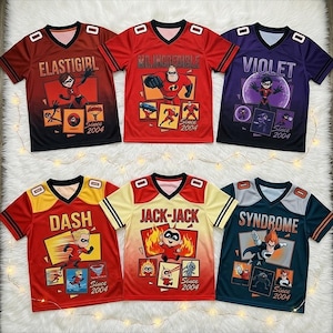 May include: Six colorful athletic jerseys featuring characters from The Incredibles. Each jersey has a different character's name: Elastigirl, Mr. Incredible, Violet, Dash, Jack-Jack, and Syndrome. Each jersey has a unique design and the text "Since 2004".