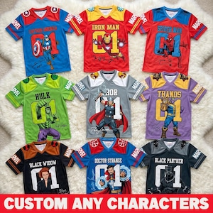 May include: Nine colourful Marvel-themed jerseys with character graphics and the number 01. The jerseys feature Captain America, Iron Man, Spider-Man, Hulk, Thor, Thanos, Black Widow, Doctor Strange, and Black Panther. The text "CUSTOM ANY CHARACTERS" is at the bottom.