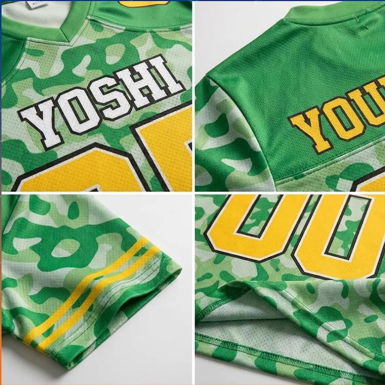 May include: A green and light green camouflage patterned jersey featuring the name YOSHI in white block letters with black outlines. The garment includes yellow numbers, yellow sleeve stripes, and a V-neck collar, constructed from a mesh fabric.