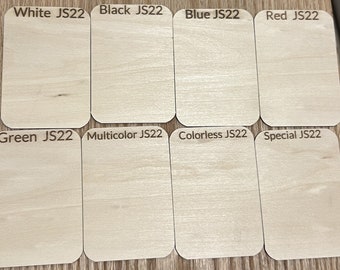 May include: Eight wooden plaques with different colors labeled: White JS22, Black JS22, Blue JS22, Red JS22, Green JS22, Multicolor JS22, Colorless JS22, and Special JS22.