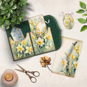 May include: A selection of spring-themed paper crafts with watercolour illustrations of daffodils and butterflies. The set includes a decorative card, tags, and an egg-shaped ornament. The colour palette is soft, with greens, yellows, and whites.