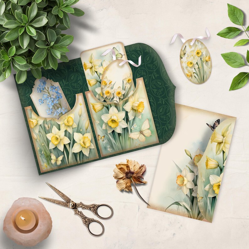 May include: A selection of spring-themed paper crafts with watercolour illustrations of daffodils and butterflies. The set includes a decorative card, tags, and an egg-shaped ornament. The colour palette is soft, with greens, yellows, and whites.