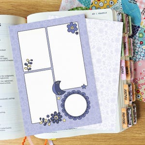 May include: A light purple paper insert featuring three rectangular frames and one circular frame, decorated with dark purple moon, star, and flower illustrations. The insert is placed on an open book with visible text and colorful book tabs.