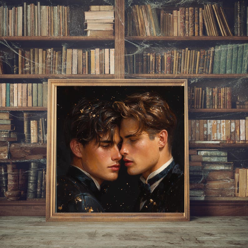 May include: A framed portrait featuring two individuals with dark, wavy hair positioned face-to-face in a close, intimate proximity. They are wearing dark, formal attire with subtle gold flecks against a dark background, presented in a gold frame.