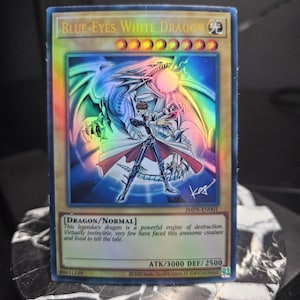 Blue-Eyes White Dragon (JMPR Kaiba Art) - Ultra - Starlight - Prismatic Secret Rare - Common - Single or Playset - Orica Proxy
