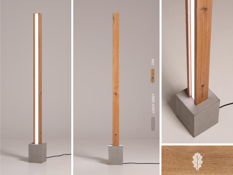 Pu&ograve; includere: Una lampada da terra moderna con una base in legno rettangolare lunga e una striscia di luce bianca che corre al centro. La base &egrave; in cemento e ha una forma quadrata. La lampada &egrave; disponibile in due finiture in legno: rovere e grigio chiaro.