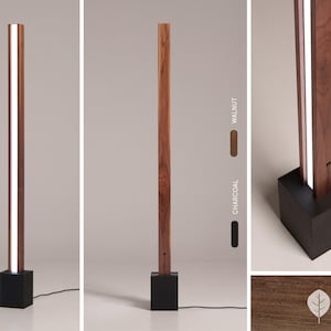 Pu&ograve; includere: Una lampada da terra moderna con una base in legno rettangolare lunga e una striscia di luce bianca che corre al centro. La base &egrave; disponibile in noce o carbone.