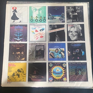 May include: A collage of album covers featuring various artists, including Bette Midler, The Eagles, The Rolling Stones, Canned Heat, The Iggles Band, Crosby, Stills, Nash & Young, Bee Gees, Roberta Flack, Dr. John, and Eric Clapton. The album covers are arranged in a grid pattern and feature a variety of colors and designs.