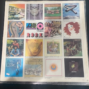 May include: A collage of album covers from the 450 Atlantic Atco Rock series. The covers feature various artists, including The Bee Gees, The Rolling Stones, Genesis, and King Crimson. The album covers are a mix of colors and styles, with some featuring portraits of the artists and others featuring abstract designs.