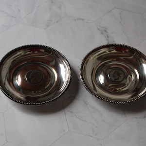 A pair of very rare antique silver plated ashtrays containing George 4th coins, early 19th century.