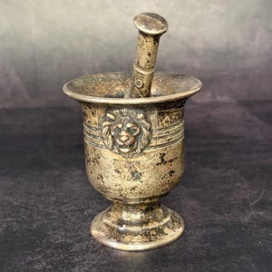 Antique apothecary mortar and pestle, lion heads, silver plated, early 20th century