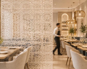 May include: A large, white, square-patterned room divider screen featuring an intricate, repeating geometric lattice design. The screen is composed of multiple modular panels arranged in a grid, creating a semi-transparent partition.