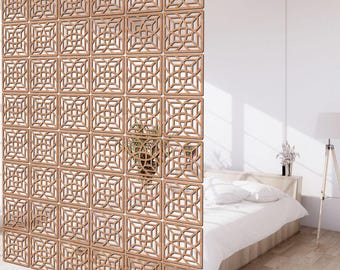 May include: A wooden room divider with a geometric pattern. The divider is made of multiple square panels with a lattice design. The divider is shown in front of a white wall and a bed.
