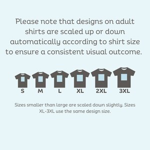 May include: Diagram showing how designs on adult shirts are scaled up or down automatically according to shirt size. The sizes shown are S, M, L, XL, 2XL, and 3XL. Sizes smaller than large are scaled down slightly. Sizes XL-3XL use the same design size.