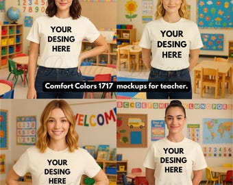 May include: Four women wearing cream-colored t-shirts with the text "YOUR DESING HERE" in black. The shirts are Comfort Colors 1717 mockups for teachers. The background includes classroom elements like alphabet charts and desks.