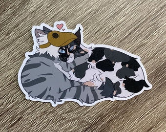 May include: A sticker of two cats cuddling, one with a brown and white patterned coat and a brown hat, the other with a black and white patterned coat. The cats are looking at each other with hearts above their heads.