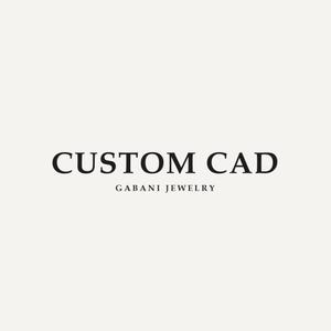Peut inclure: Sur un fond beige clair, le texte "CUSTOM CAD" est écrit en noir gras et centré. En dessous, en noir plus petit et fin, on peut lire "GABANI JEWELRY". L'image est un logo pour une entreprise de joaillerie.