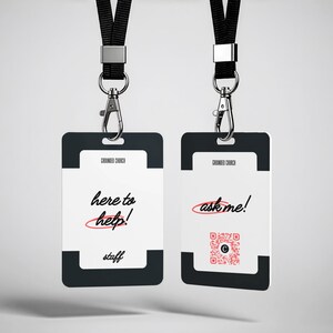 May include: Two vertical rectangular ID badges with black borders and white centers, hanging from black lanyards with silver clips. The left badge reads Grounded Church, here to help!, and staff. The right badge reads Grounded Church, ask me!, and a QR code.