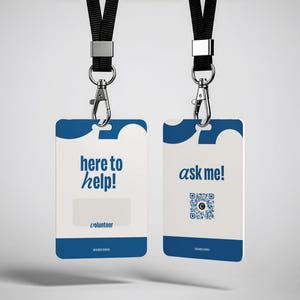 May include: Two white and blue rectangular ID badges with black lanyards and silver metal clips. The left badge displays the text here to help! and volunteer. The right badge features the text ask me! above a square QR code graphic.