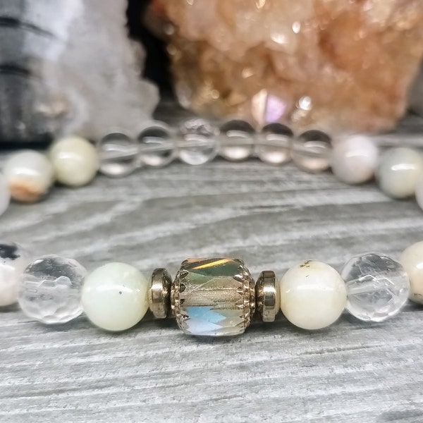 Mystic White Opal, Clear Quartz, Titanium Pyrite.ALL Chakras.Clears and Protects the Aura.Releases stagnant energy in the emotional body.8mm