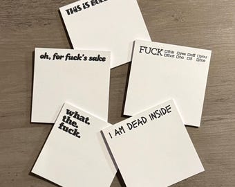 May include: A collection of white sticky notes with black handwritten text. The notes display phrases like "THIS IS BULLSHIT...", "oh, for fuck's sake", "what. the. fuck.", "I AM DEAD INSIDE", and "FUCK".