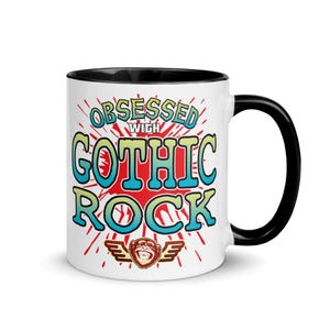 Puede incluir: Taza de cerámica blanca con interior y asa negros. La taza presenta el texto "OBSESSED WITH GOTHIC ROCK" en una fuente colorida y estilizada, con una criatura simiesca con alas debajo.
