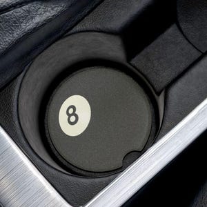 May include: Black car cup holder with a black 8-ball cup coaster.