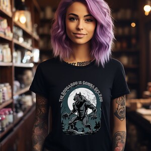 May include: Black t-shirt with a graphic of a werewolf howling at the moon. The text "The Rougarou is gonna get you" is printed on the shirt.
