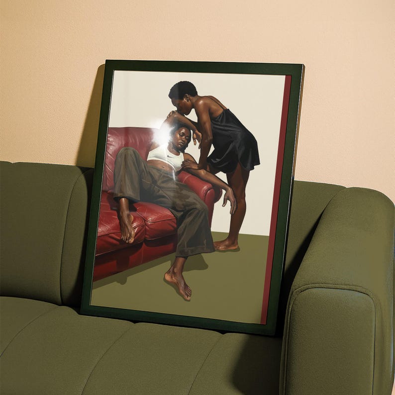 A framed poster with a black, lesbian couple kissing.