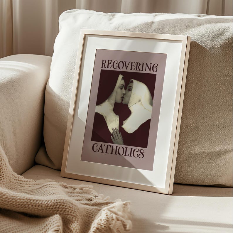 A framed poster featuring two kissing nuns, paired with the text "RECOVERING CATHOLICS."