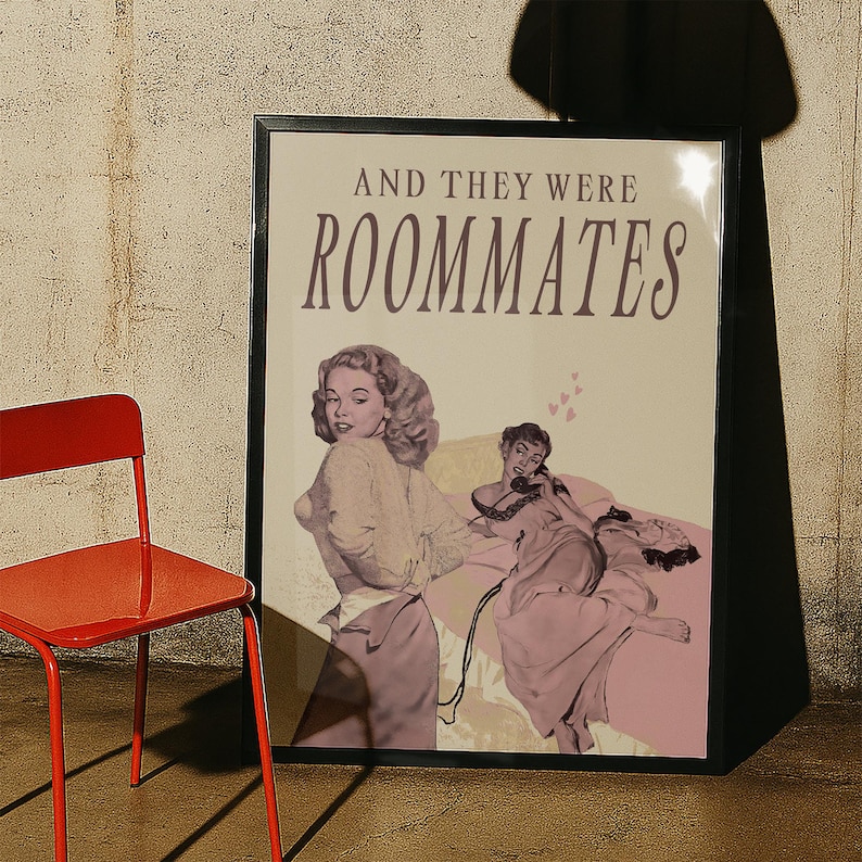 A framed print with two ladies in a romantic pose, with the text 'and they were roommates'.