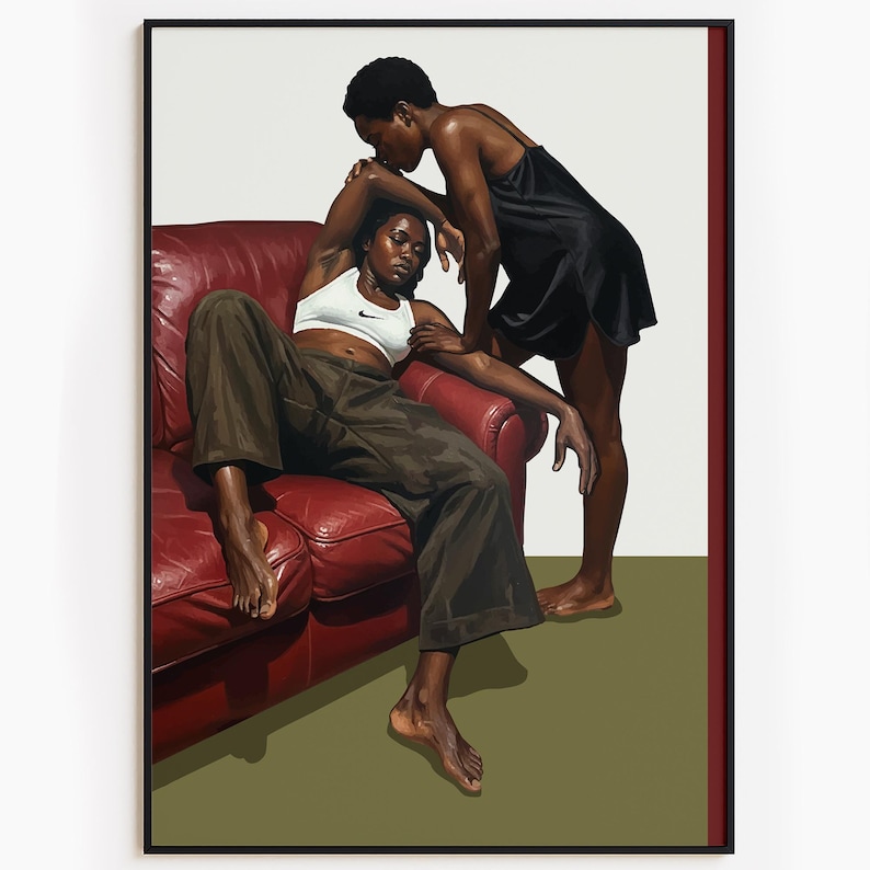 A framed poster with a black, lesbian couple kissing.